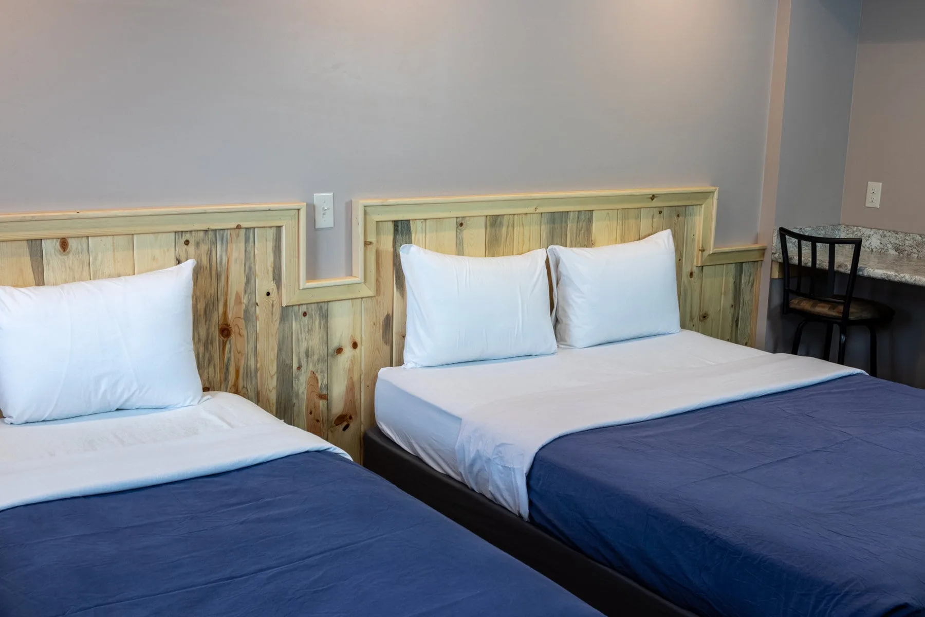 Room 4 with one queen and one twin bed — Prospector Motel